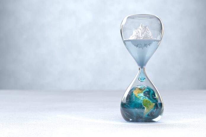 Cambio Climatico Reloj de arena con una representación del planeta